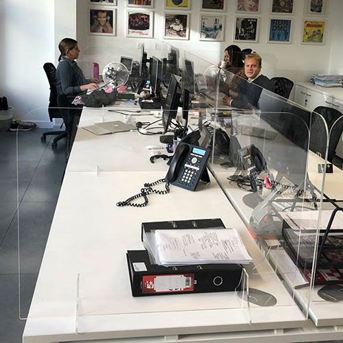 social distancing perspex desktop dividers positioned to the back and sides of the desktop