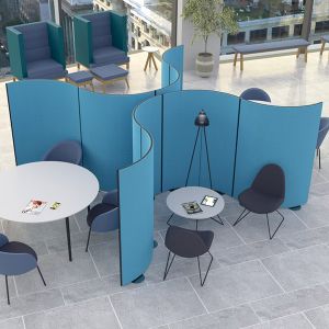Curved acoustic office partitions linked to create smaller seating areas. 